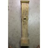 Carved wooden column decorated with acanthus leaf .
