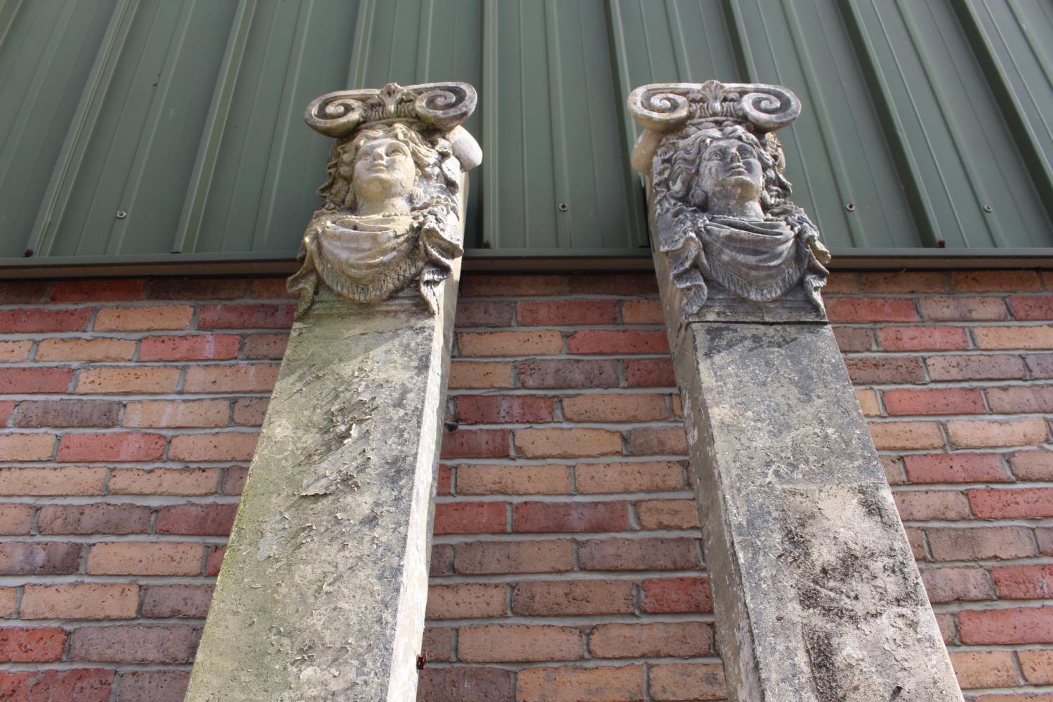 Pair of resin columns decorated with masks. - Image 2 of 2