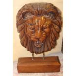 Carved wooden model of a Lions head.