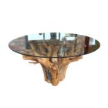 Unusual Mindi wood glass topped centre table.