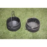 Pair of cast iron skillet pots.