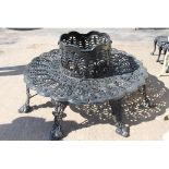 Decorative cast iron tree surround garden bench.