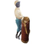 Ceramic model of a golfer's caddy.