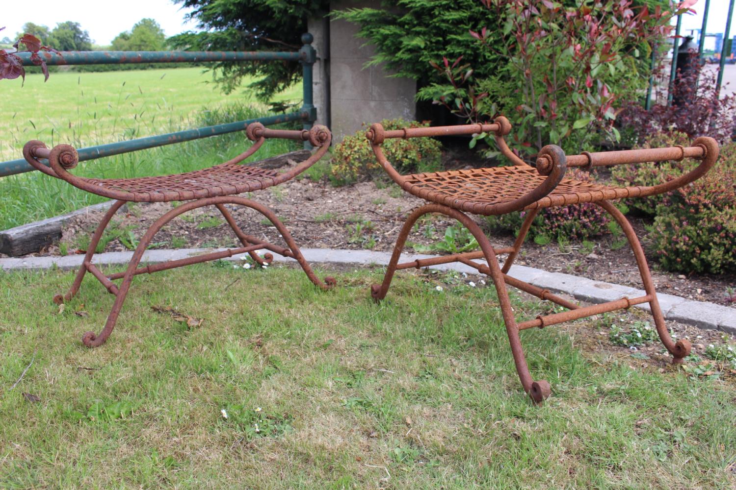 Pair of wrought iron garden stools.