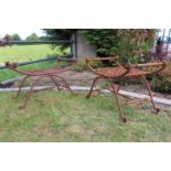 Pair of wrought iron garden stools.