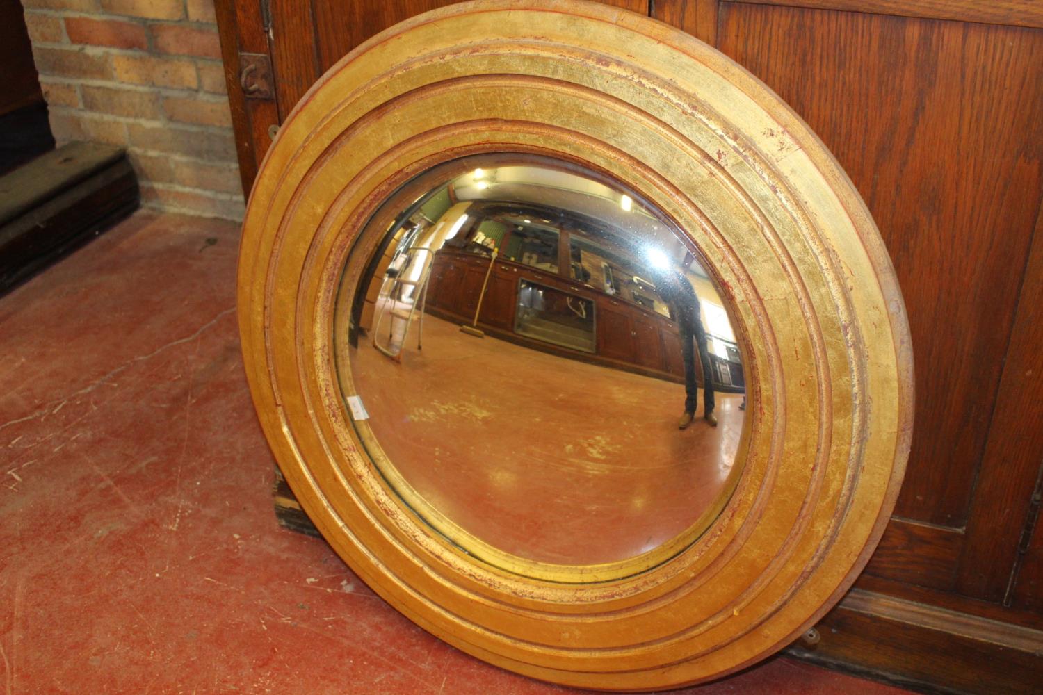 Converse circular mirror.