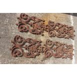 Four decorative cast iron panels.