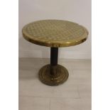 Brass embossed table.