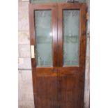 Oak door with two glazed panels LADIES and GENTS.