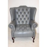 Good quality leather upholstered wingback chair.