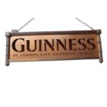 Guinness hanging advertising sign in copper frame.