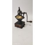 Early 20th C. brass and cast iron coffee grinder.