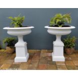 Pair of good quality cast iron urns.