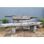 Rustic garden bench made from railway sleepers.