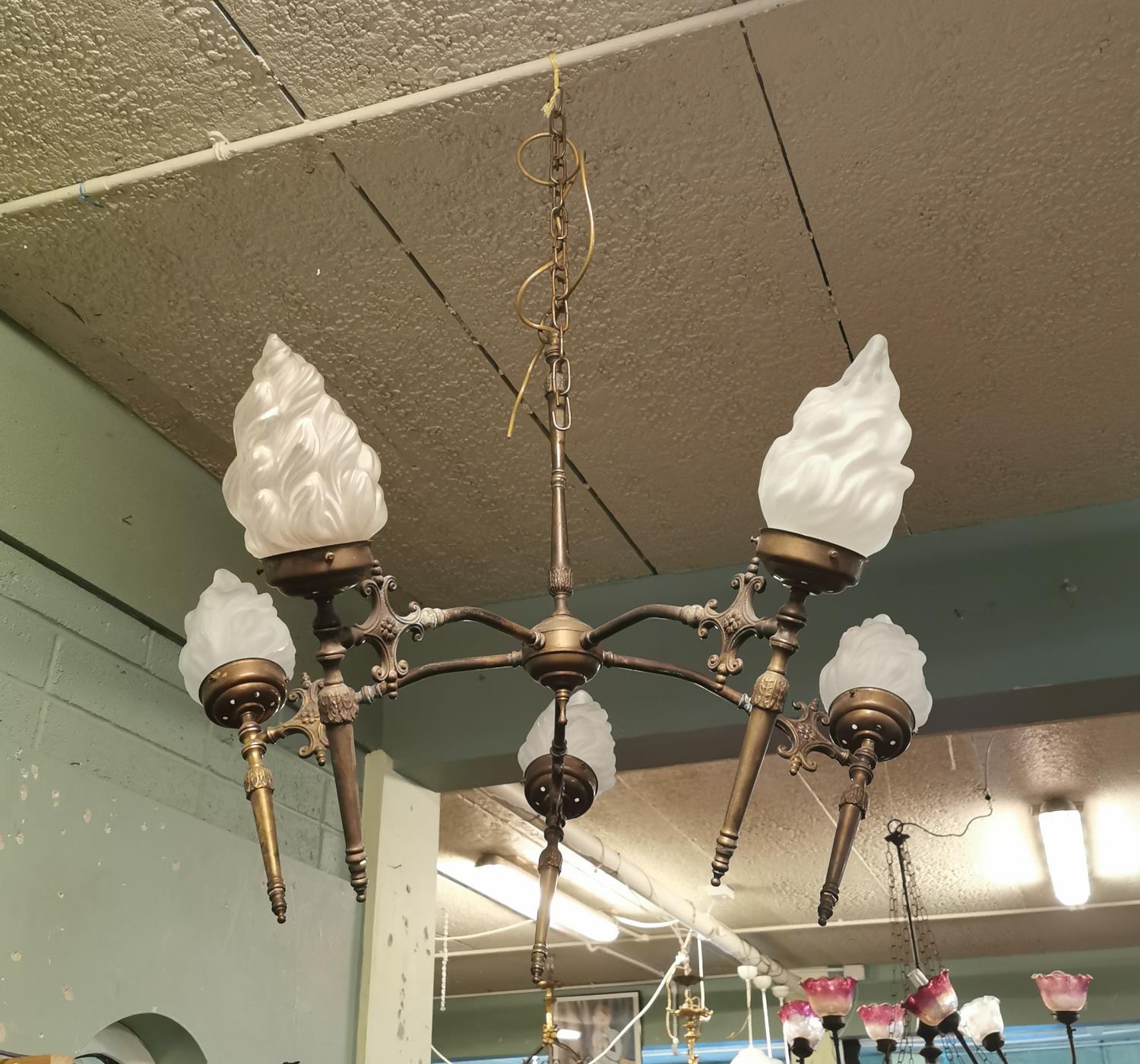 Pair of exceptional quality early 20th C. brass chandeliers.