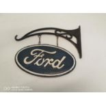 Cast iron Ford advertising sign with cast iron bracket.