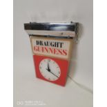 Draught Guinness advertising clock.