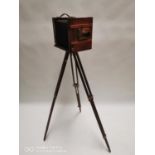 Early 20th. C. mahogany and brass camera on tripod legs. (144 cm H x 53 cm W x 23 cm D)