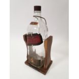 1970's Johnnie Walker Scotch Whiskey bottle on stand.