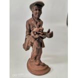 Cast iron door stop in the form of a golfer.