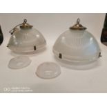 Pair of 1940's holophane hanging light shades with brass galleries.