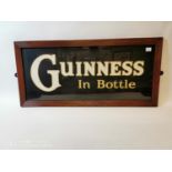 Guinness In Bottle advertising sign.