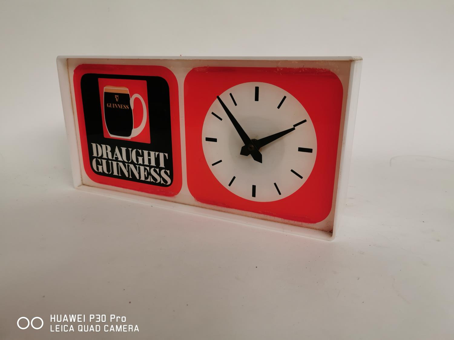 Draught Guinness advertising clock.