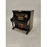 Unusual music box in the form of a piano.