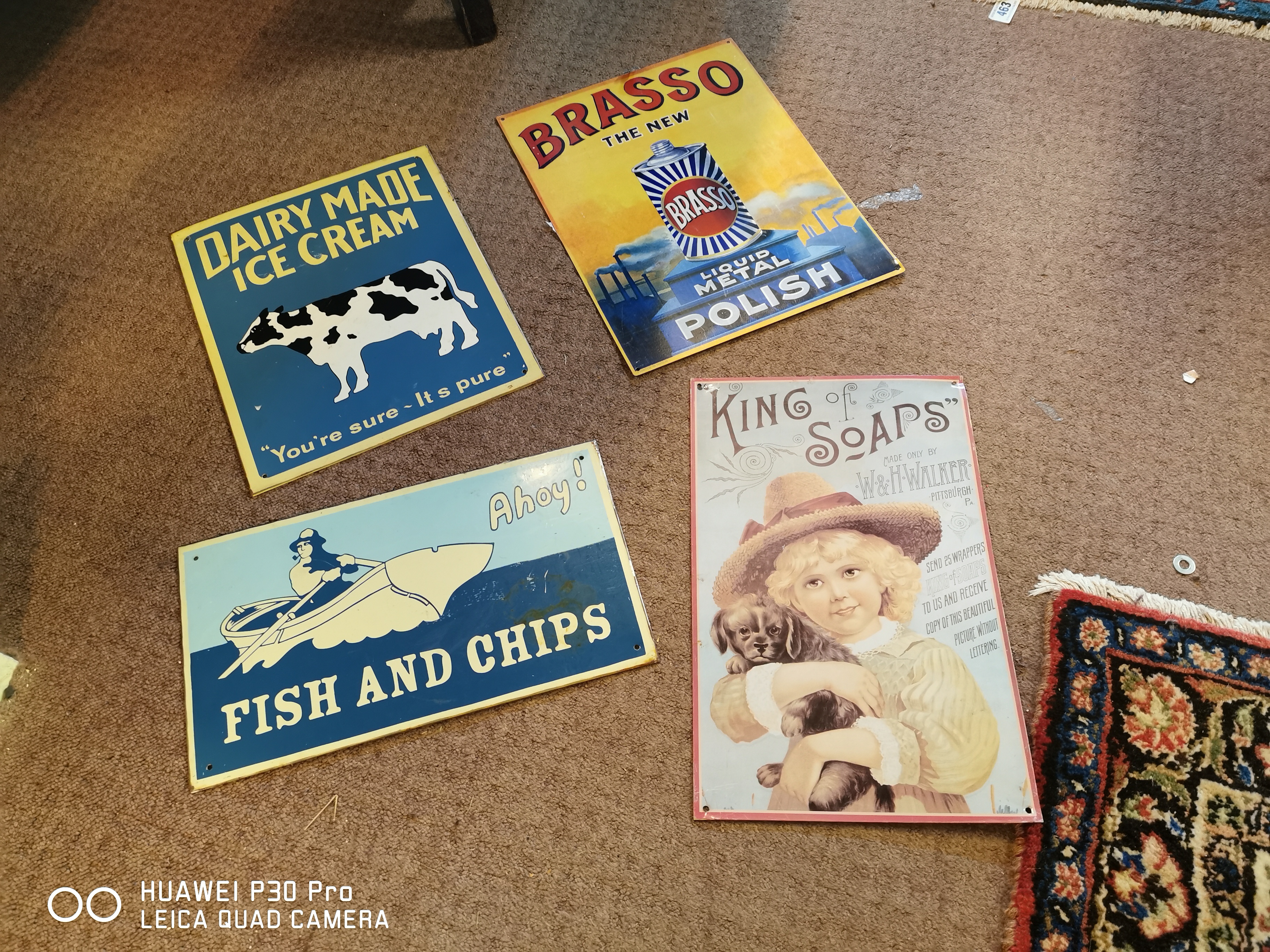 Set of four tin plate advertising signs.