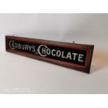 Rare Cadbury's Chocolate reverse painted glass advertisement.