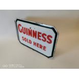 Guinness Sold Here advertising sign.