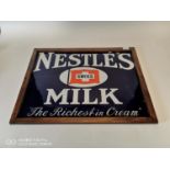 Nestlé's Swiss Milk advertising sign.