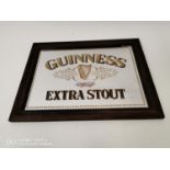 Guinness Extra Stout advertising mirror.