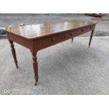 19th. C. painted pine table with eight drawers on turned legs