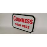 Guinness Sold Here advertising sign.