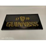 1759 Guinness advertisement on glass.