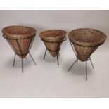 Set of three Mid Century wicker baskets on metal stands {61 cm H x 50 cm Dia.}.