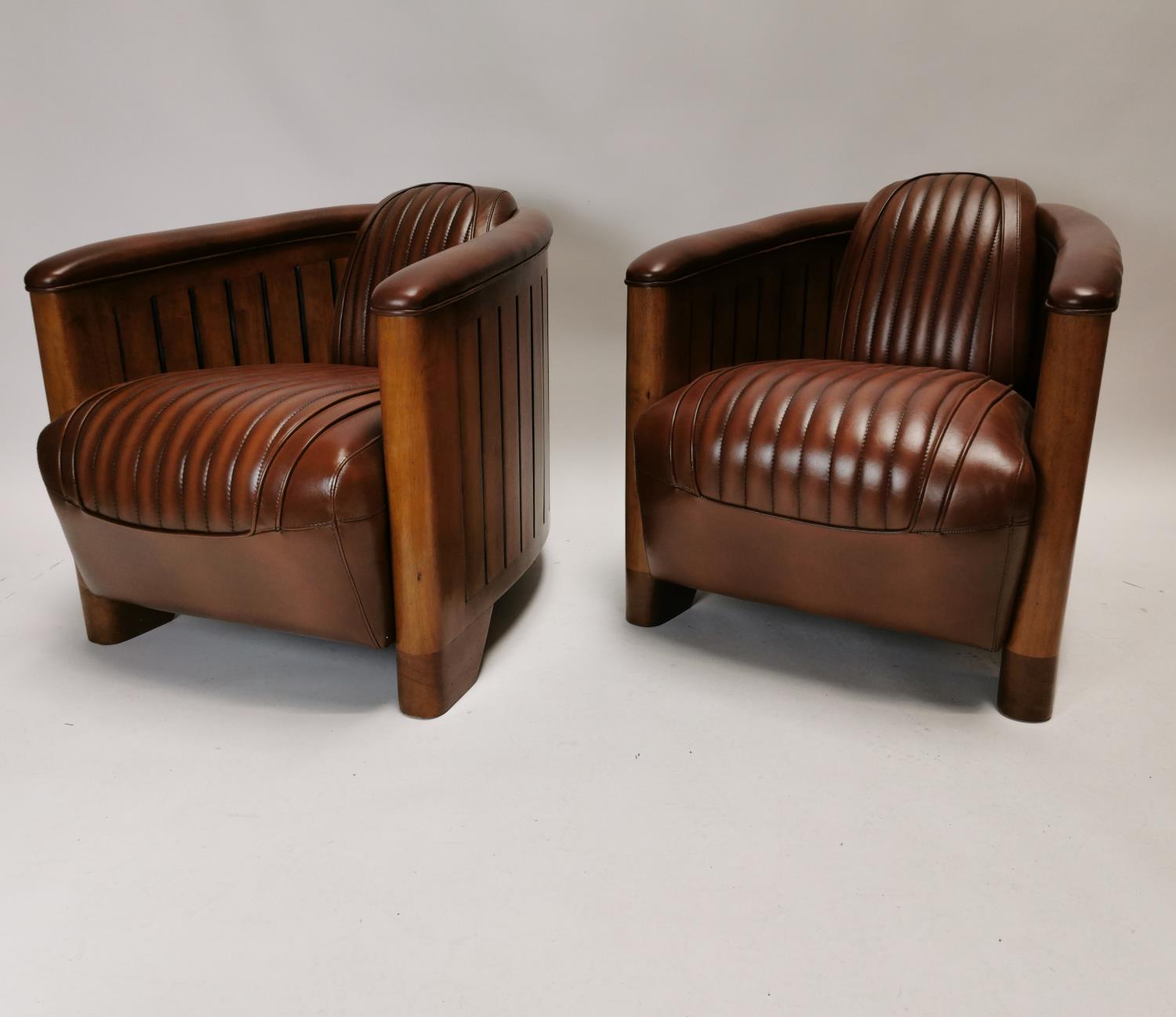Pair of exceptional quality Art Deco style leather upholstered and wood Aviator club chairs {72 cm H