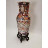 Large ceramic oriental vase decorated with dragon and lotus flowers.