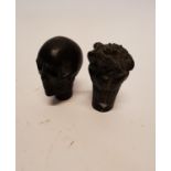 Two rare bronze walking stick handles depicting a skull and a frog.