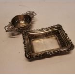 Silver ring tray and tea strainer.