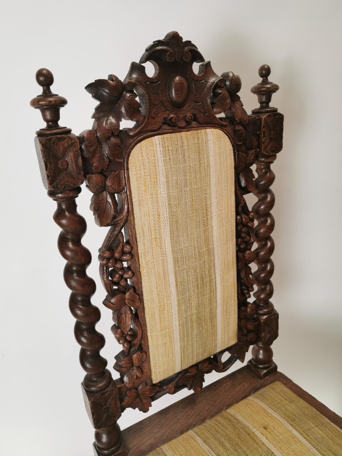 19th. C. upholstered carved oak hall chairs decorated with vines. {108 cm H x 48 cm W x 43 cm D}. - Image 2 of 3
