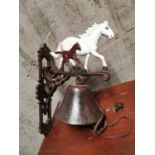 Cast iron wall bell surmounted with a mare and foal. {34 cm h x 34 cm L}