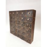 Early 20th. C. pine bank of shop drawers. {76 cm H x 85 cm W x 19 cm D}.