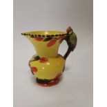 Early 20th C. Wade pottery water jug decorated with woodpecker {21 cm H x 21 cm W x 15 cm D}.