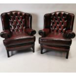 Pair of good quality wingback oxblood leather armchairs. {104 cm H x 84 cm L x 94 cm D}.