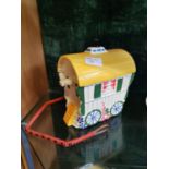 Ceramic biscuit barrel in the form of a caravan.