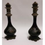 Pair of good quality hand painted ceramic and brass table lamp .
