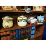 Collection of four vintage ceramic and silver plated biscuit barrels.