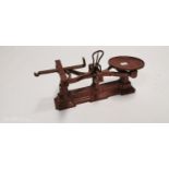 Early 20th. C. cast iron shop scales. { 23cm H X 48cm W X 20cm D }.